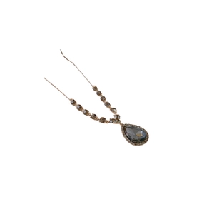 Elegant gold teardrop sweater necklace with dark grey gemstone and diamond accents