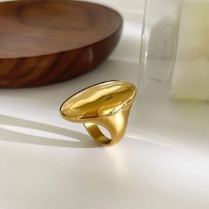 Polished gold stainless steel oval dome ring with a bold minimalist statement design