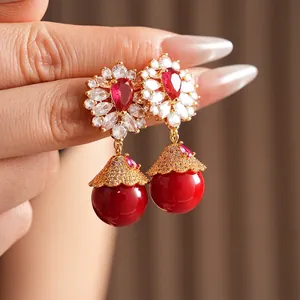 Vintage style drop earrings with red ruby petals and large round hanging beads