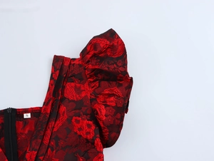 Detail of floral dress showing puff sleeves, zipper closure and size S label