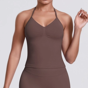 Detail of seamless brown halter-neck sports tank with front ruched design and slim straps