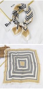 Detail of satin square scarf featuring geometric black and khaki stripes pattern
