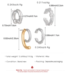 Mesure détaillée de quatre boucles d'oreilles et bagues d'oreilles en alliage avec poids