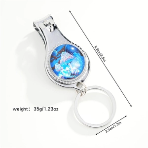 Detail view of mushroom nail clipper keychain showing dimensions 8.8cm and 35g weight