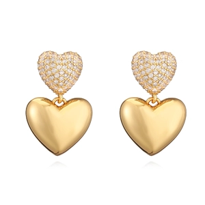 Elegant gold plated double heart drop earrings with shimmering zircon stones on white background