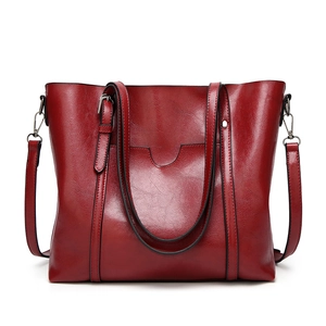 Deep red soft leather large bucket bag with shoulder strap and U-shaped pocket