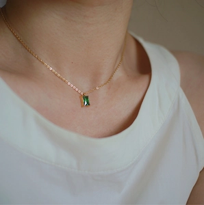 Elegant gold titanium steel necklace with rectangular emerald green gemstone pendant