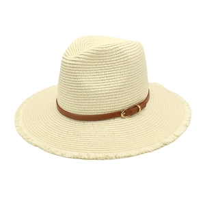 Straw sun hat in cream with brown leather band and frayed brim for beach vacation