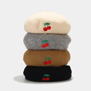 Wool beret hats for women featuring cherry embroidery in beige, grey, camel, and black colors