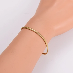 Minimalist gold snake chain bracelet in stainless steel with a sleek polished finish