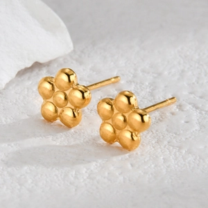 Minimalist gold flower stud earrings in stainless steel with a polished finish
