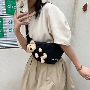 Women's black canvas crossbody bag with cute 3D plush bear and adjustable shoulder strap