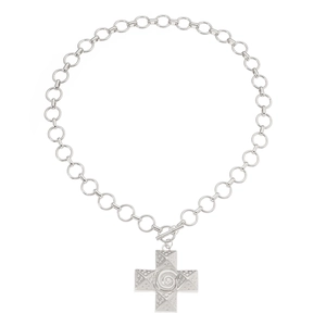 Detail of silver necklace featuring a spiral cross pendant and T-bar toggle clasp