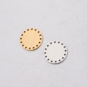 Macro view of gold and silver porous round mirror stainless steel pendant blanks