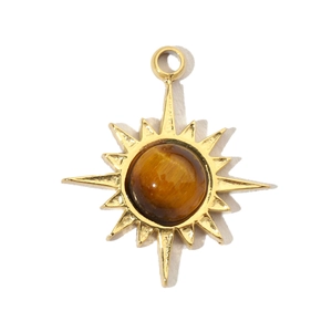 Macro shot of sunburst pendant with golden frame and natural tiger eye stone center