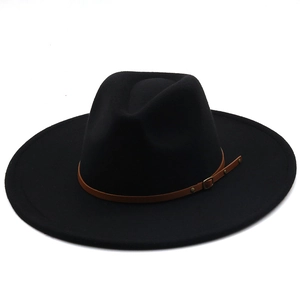 Close-up of a wide brim wool fedora hat featuring a brown leather decorative band
