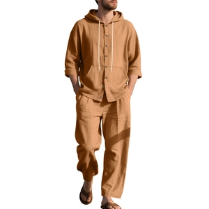 Detail of khaki linen long sleeve hooded shirt and trousers set with button closure