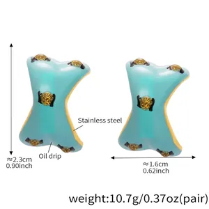 Detail view of heavy weight earrings with blue enamel butterfly wing and size measurement