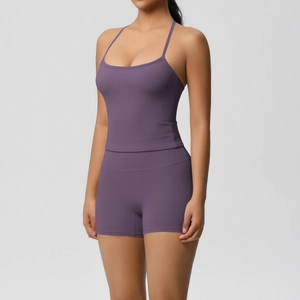 Detail of deep purple two-piece yoga set with fine straps and high-waist shorts