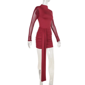Detail of wine red bodycon mini dress featuring sheer mesh sleeves and waist drape