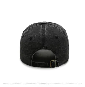 Detail view of washed denim baseball cap back with antique bronze metal buckle adjustment
