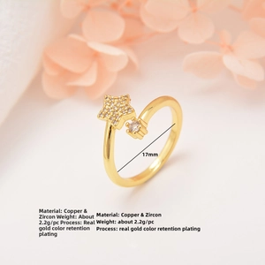 Detail of copper gold plated ring with star zircon inlay and 17mm adjustable opening