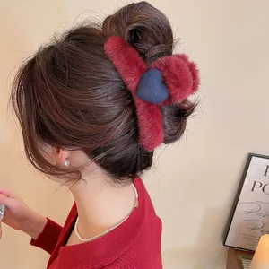 Elegant burgundy faux fur hair claw clip with blue heart detail for autumn and winter