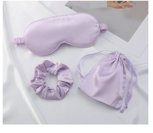 Lavender silk sleep set featuring padded eye mask, scrunchie, and matching storage bag