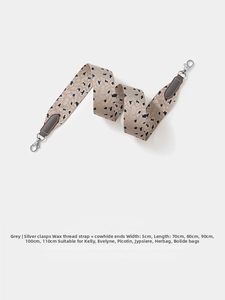Close-up of 5cm wide grey leopard pattern strap with silver buckle and cowhide joints