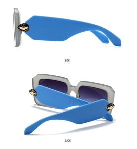 Detail of blue temples with golden snake-shaped metal hinges and honeycomb scale texture
