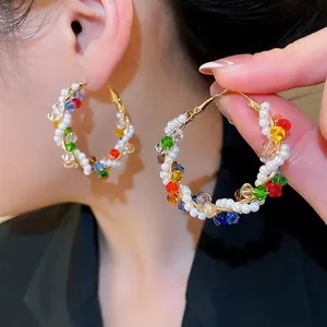 Rainbow crystal hoop earrings with white pearls and gold wire wrapped details