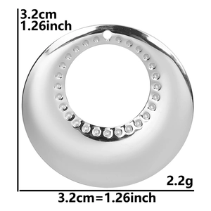 Detail of silver stainless steel circular pendant with 3.2cm diameter and textured edges