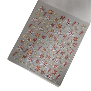 3D Chinese New Year nail stickers featuring gold foil lions and lucky character patterns