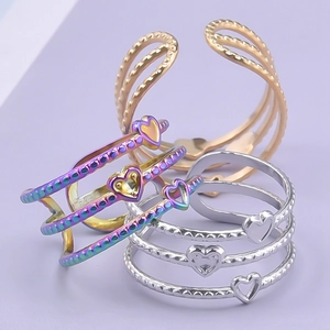Adjustable hollow heart stainless steel rings in iridescent silver and gold finishes