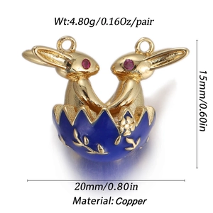 Close-up of golden copper rabbit charms in blue eggshells for jewelry making
