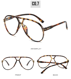 Detail view of tortoiseshell aviator glasses with double bridge and gold metal accents