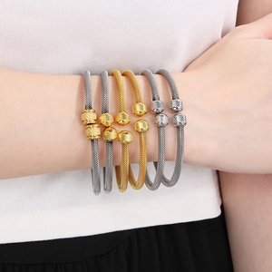 6-piece set of woven gold and silver stainless steel open bangles with ribbed end caps