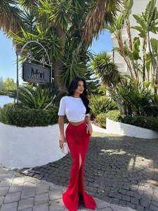 Women's summer two-piece set featuring a white crop top and red high-waist maxi skirt