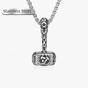 Close-up of vintage Viking Mjolnir pendant in aged stainless steel with bead chain