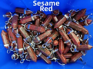 Macro shot of sesame red crystal hexagonal column pendants with silver metal clasps
