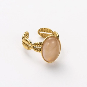 Detailed view of an 18k gold plated open ring featuring a large oval peach gemstone inlay