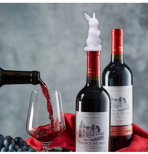 Silicone rabbit wine bottle stopper mold shown on a red wine bottle in elegant setting