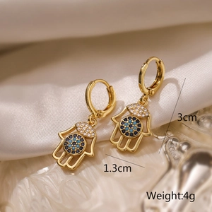 Detailed size view of Hamsa hand earrings with blue zircon in 18K gold plated copper