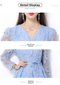 Detail of V-neck and waist belt on light blue lace floral embroidered dress