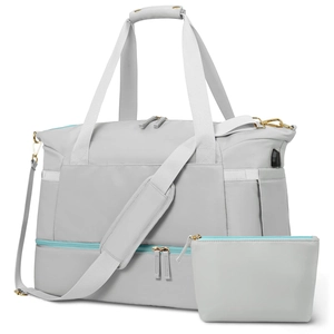 Grey waterproof duffel bag with matching cosmetic pouch and external USB charging port