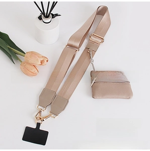 Detail of khaki wide crossbody strap with matching zipper pouch and gold metal hardware