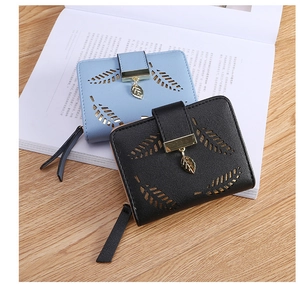 Detail of leaf hollow-out design and gold leaf pendant on women small PU leather wallets