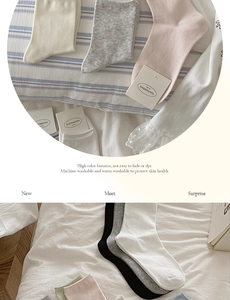 Close-up of pastel cotton socks with soft knit texture and minimalist paper packaging