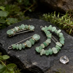 Detail of three natural green crystal hair clips with moon shape on a mossy rock background