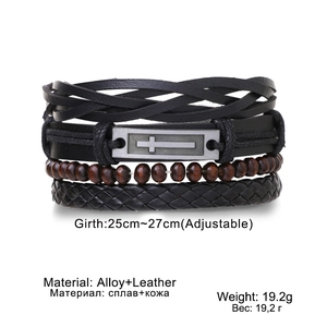Detail view of multi-layer leather bracelet with cross alloy plate and wooden beads